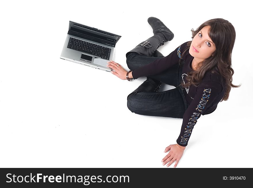 Young brunette girl in black with lap top computer representing modern communications. Young brunette girl in black with lap top computer representing modern communications.