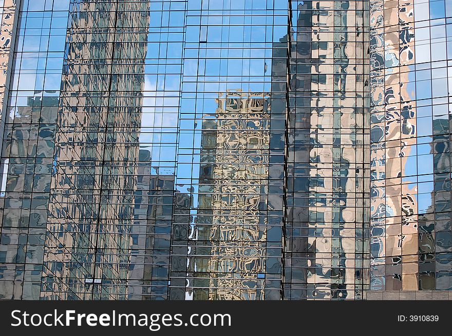 Skyscrapers reflected in another tall glass building in Boston, Massachusetts.