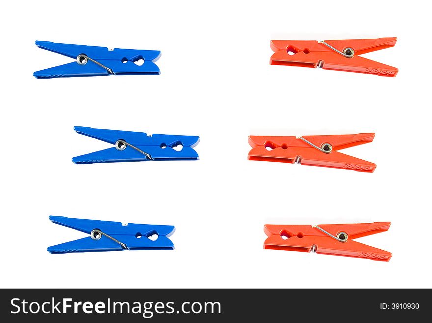 Red and blue clothes peg isolated on white background