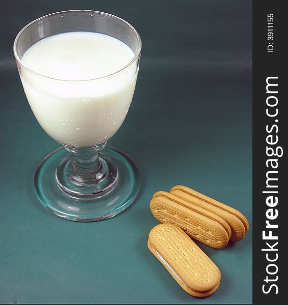 A picture of a delicious glass of milk and cookies