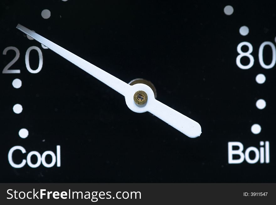 White pointer that indicate from cool to boil on black background. White pointer that indicate from cool to boil on black background