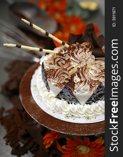 A Birthday Cake being decorated at the bakery. A Birthday Cake being decorated at the bakery