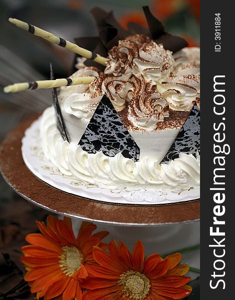 A Birthday Cake being decorated at the bakery. A Birthday Cake being decorated at the bakery