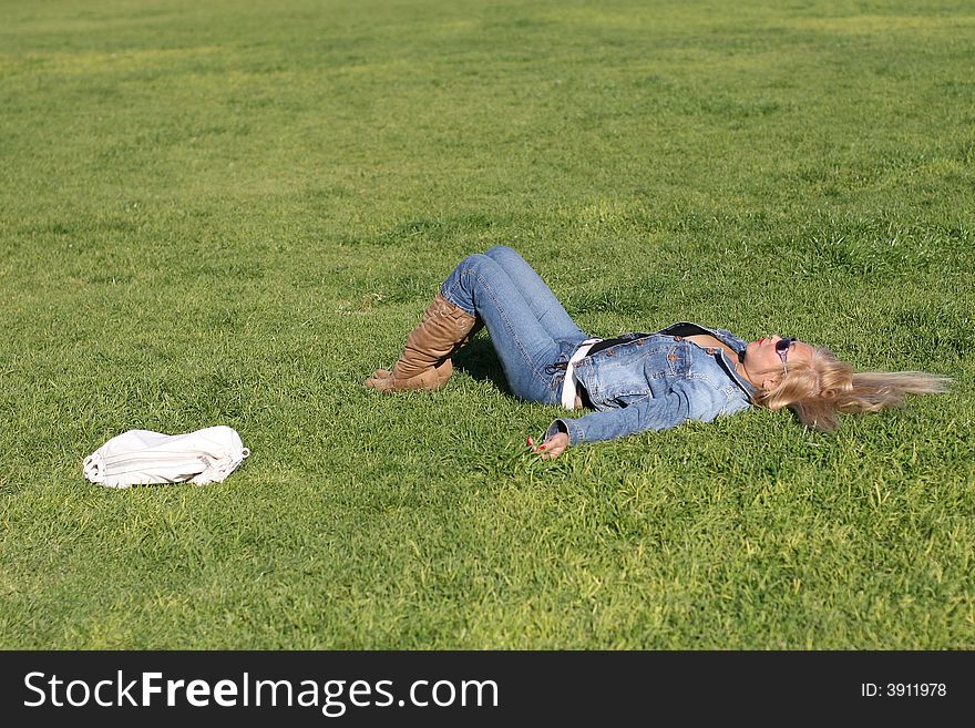 Woman having a break at the park. Winter season. Woman having a break at the park. Winter season.