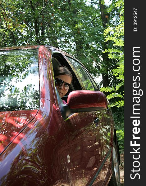 Young Woman In A red Car. Young Woman In A red Car