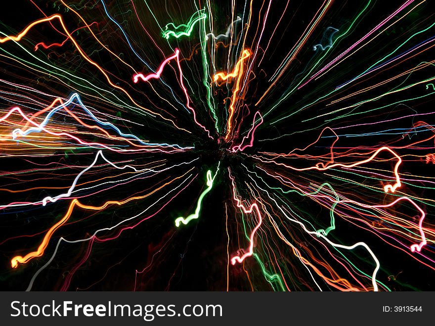 Multicolor abstract light tracks against black background