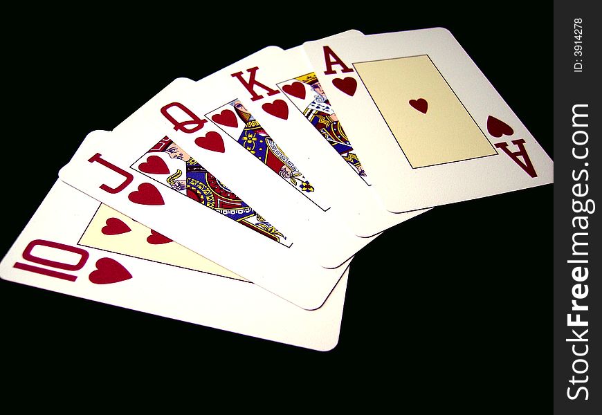 An image with a close detail of a royal flush on black background