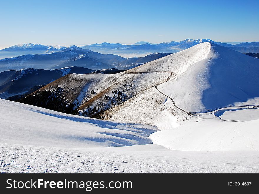 Majestic mountain peaks and ski slopes. Majestic mountain peaks and ski slopes