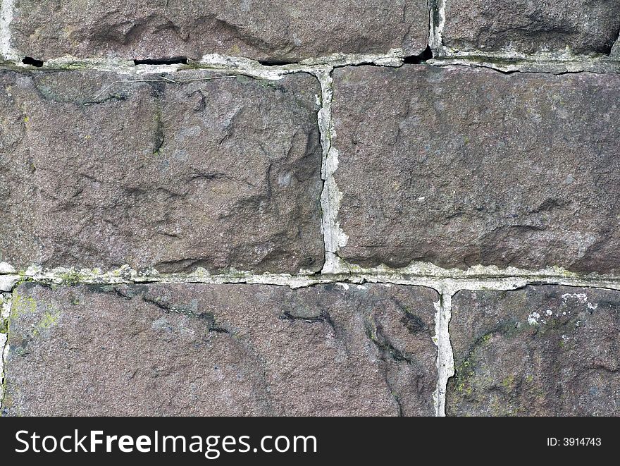 Old stone wall textured background. Old stone wall textured background