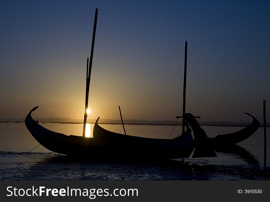 Typycal moliceiro portuguese boat on the sunset. Typycal moliceiro portuguese boat on the sunset