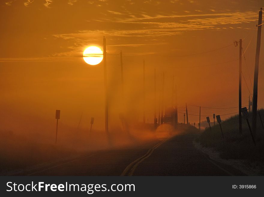 A hazy mist filled morning on Dune road in the Hamptons, NY. A hazy mist filled morning on Dune road in the Hamptons, NY