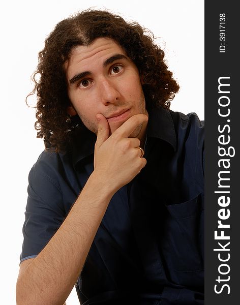Portrait of studious guy with long curly hair in blue shirt, isolated on white