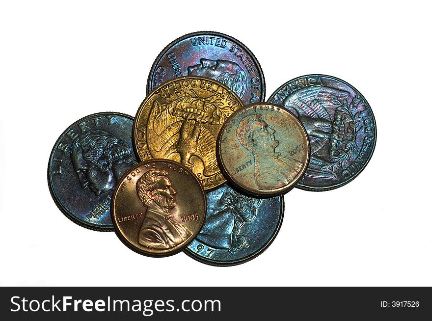 Small stack of coins with variegated patinas.  Brilliant colors.  Pennies and Quarters. Small stack of coins with variegated patinas.  Brilliant colors.  Pennies and Quarters.