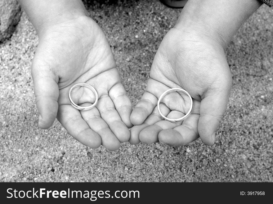 Two wedding rings in two hands