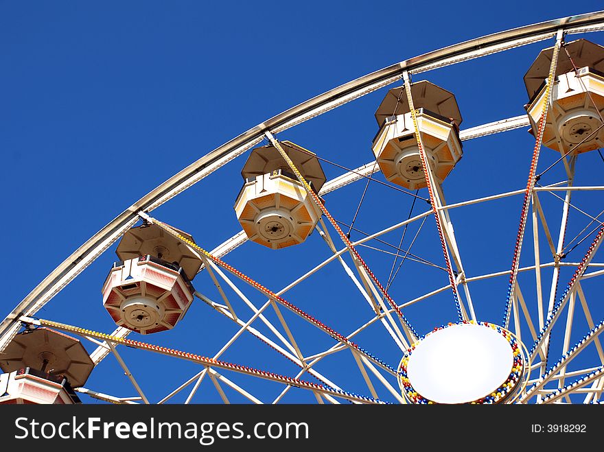 Large ferris wheel in Chicago on the blue sky.