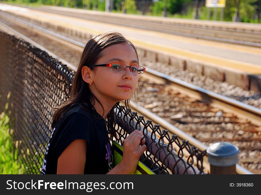 Young girl looking at the train