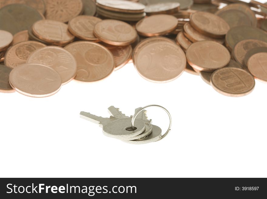 Bunch of keys in front of pile of cents. Keys to money.