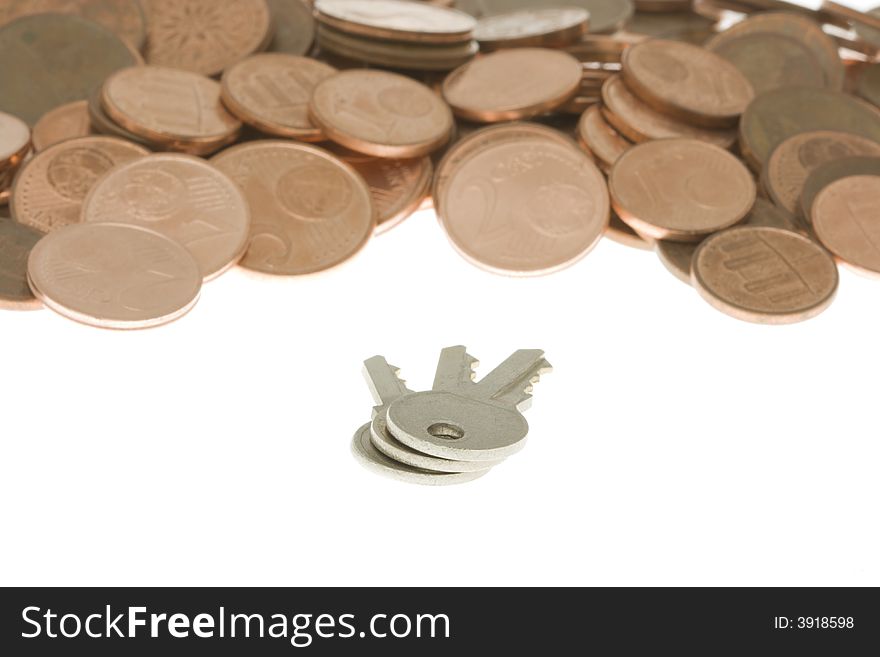 Bunch of keys in front of pile of cents. Keys to money.