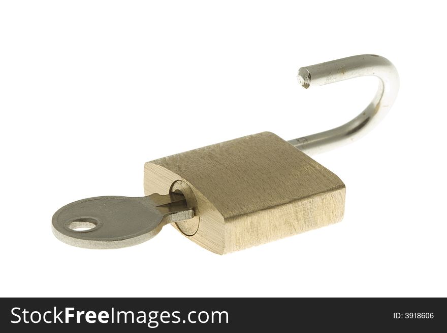 Isolated opened brass padlock with key inside