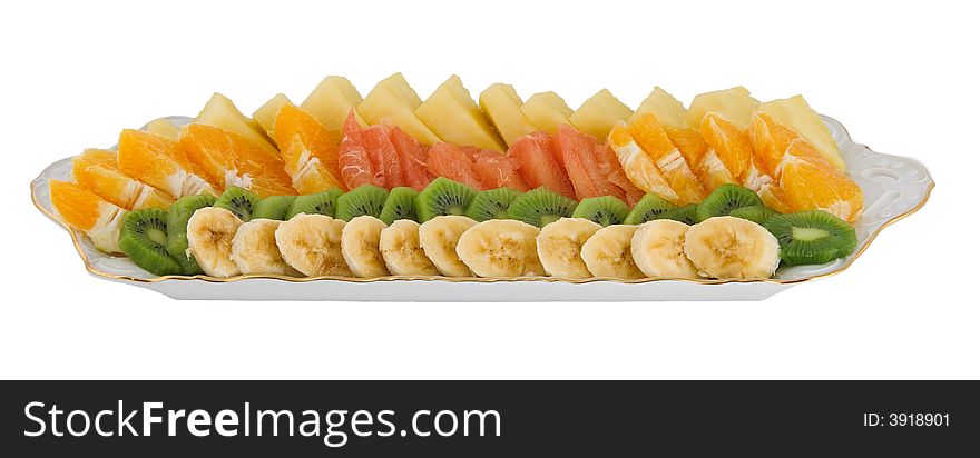 Fruit salad made of banana, kiwi, orange, grapefruit and pineapple isolated on white