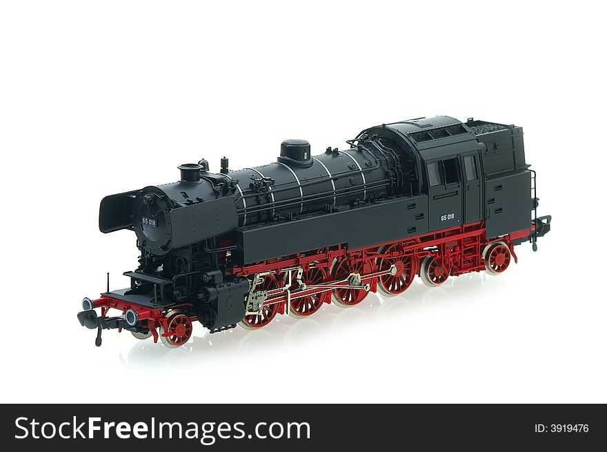Retro locomotive model on the white background. Retro locomotive model on the white background