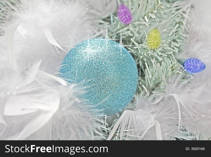 Blue Christmas ball and white feather. Blue Christmas ball and white feather.