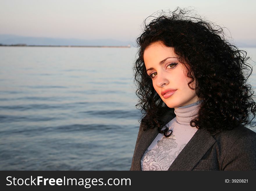 A beautiful brunette model at the beach. A beautiful brunette model at the beach