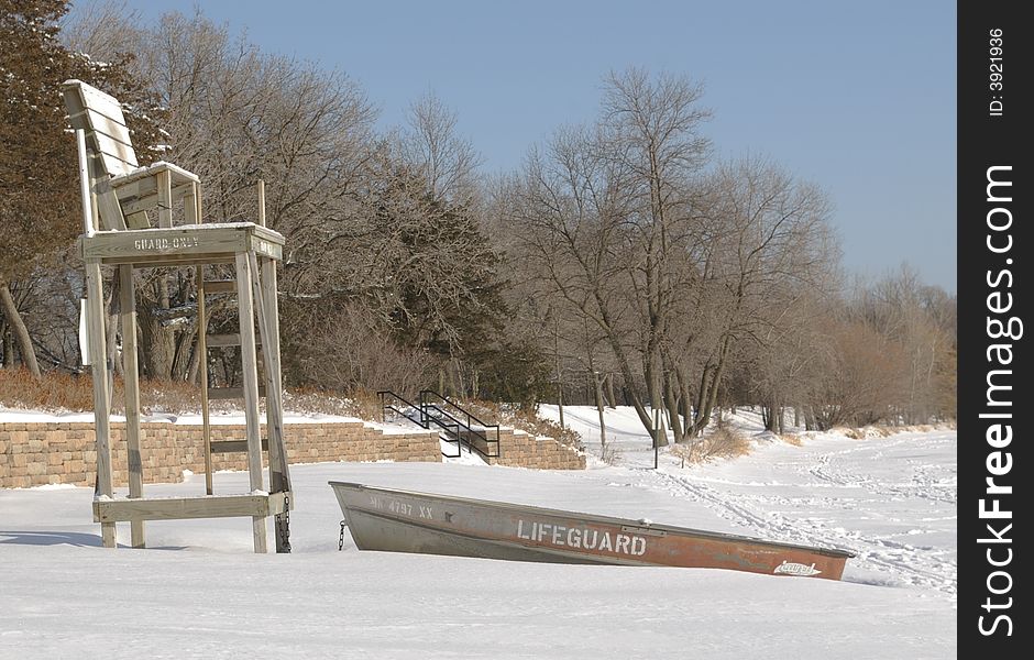 Lifeguard post and boat on a snow covered beach. Lifeguard post and boat on a snow covered beach.