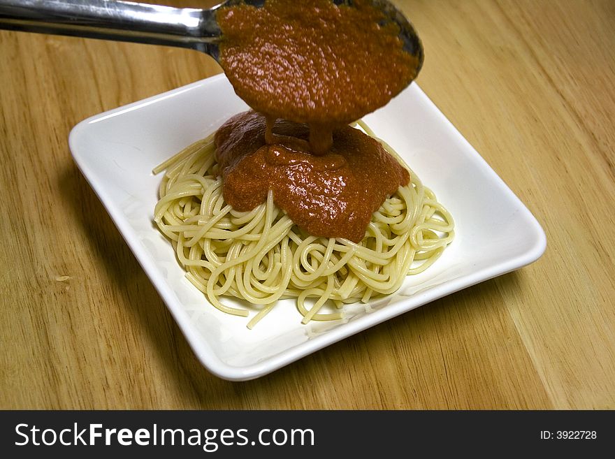 Serving pasta noodles on a white plate. Serving pasta noodles on a white plate.