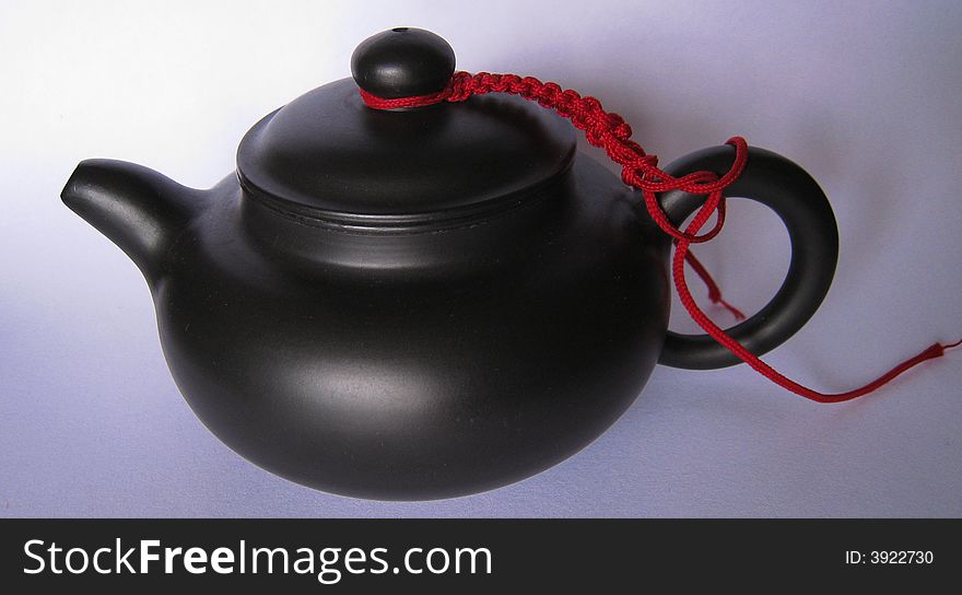 It is Chinese teapot with red wire.