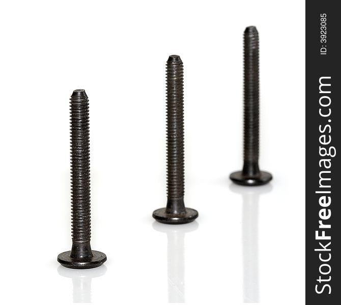 Three metal screws isolated over white