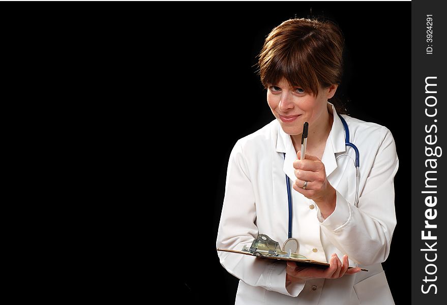 Attractive young lady doctor in white coat with stethosope lecturing a patient - on black background. Attractive young lady doctor in white coat with stethosope lecturing a patient - on black background