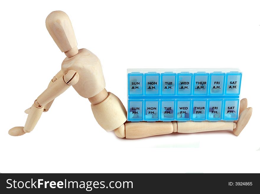 A mannequin with a reminder pill box, isolated on white. A mannequin with a reminder pill box, isolated on white
