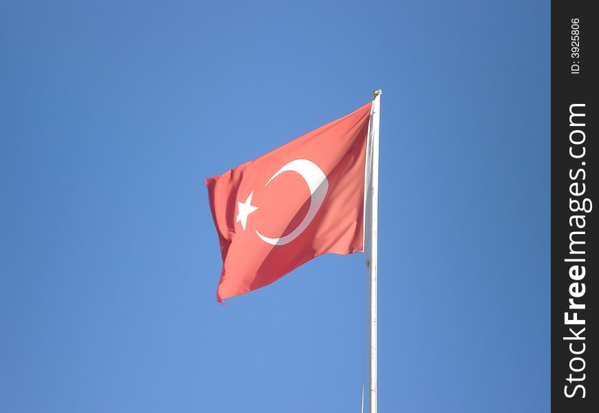 Turkish national flag on a blue sky background. Turkish national flag on a blue sky background