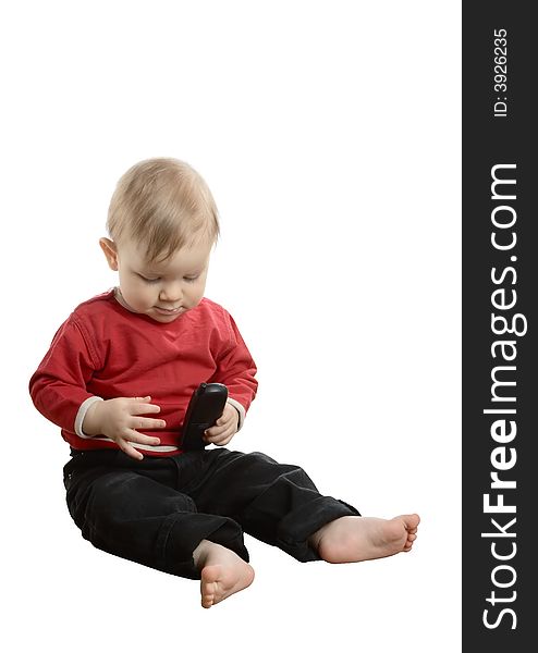 Barefoot baby in a red shirt with phone  isolated on a white background. Barefoot baby in a red shirt with phone  isolated on a white background