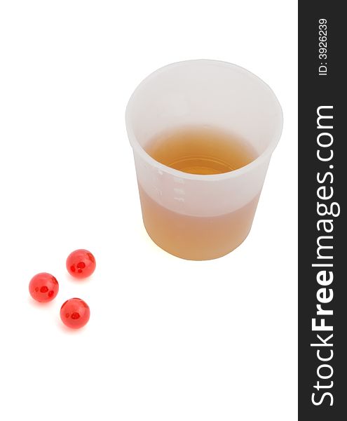 Beaker with potion and tablets  isolated on white backgrounds