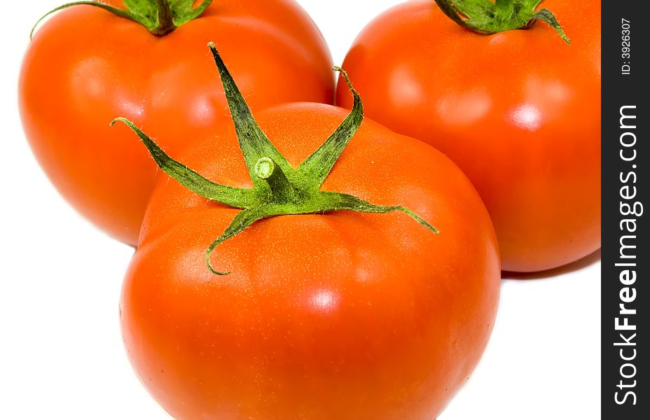 Three tomatoes isolated