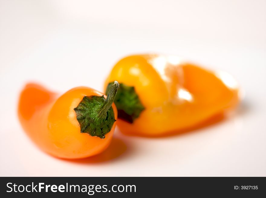 Sweet Orange Peppers on a white background.