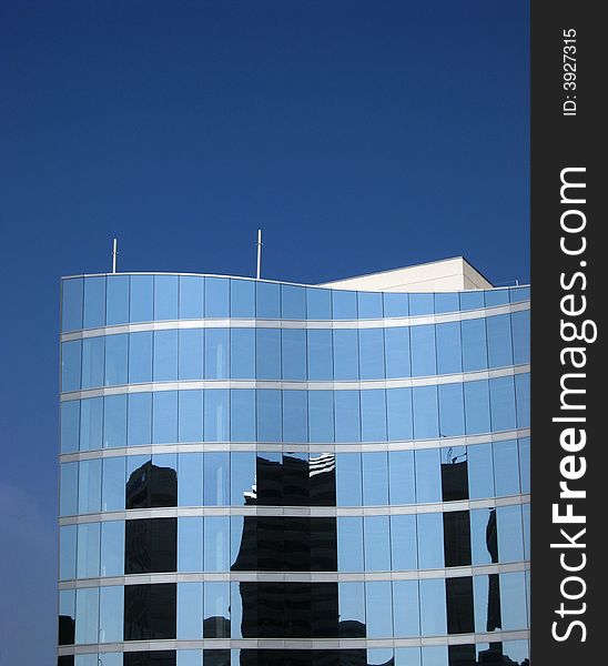 Reflection of buildings in window of office building. Reflection of buildings in window of office building