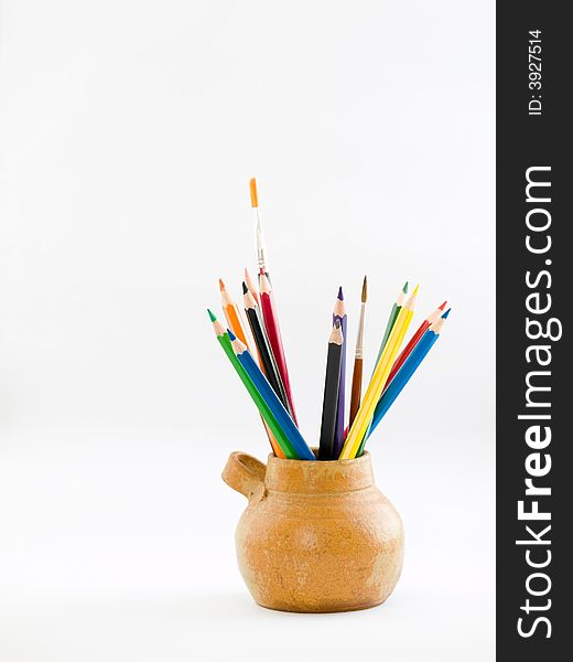 Still life of a honey pot used as a colored pencils holder. Still life of a honey pot used as a colored pencils holder