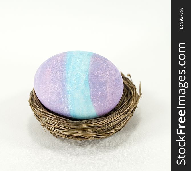 Blue and purple striped, dyed Easter egg. Blue and purple striped, dyed Easter egg.