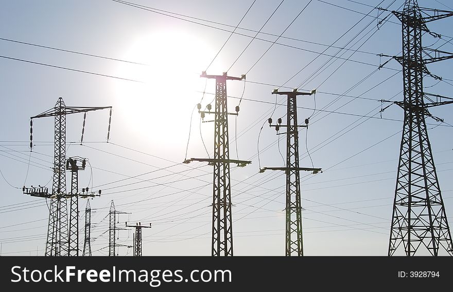 Electrical tower on a background of the blue sky. Electrical tower on a background of the blue sky