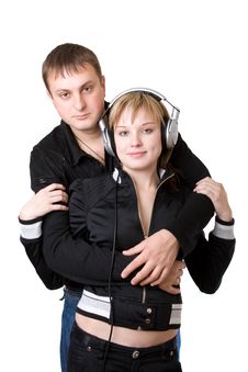 Young Happy Amorous Couple With Headphones At Home Stock Photos Young Happy Amorous Couple With Headphones At Home Stock Photos