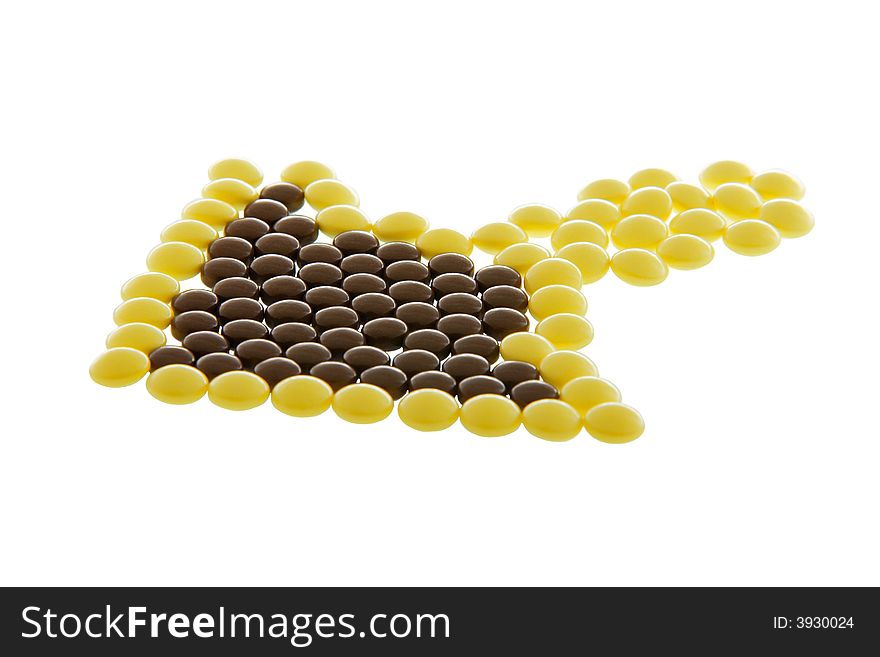 Arrow-like heap of pills isolated on white