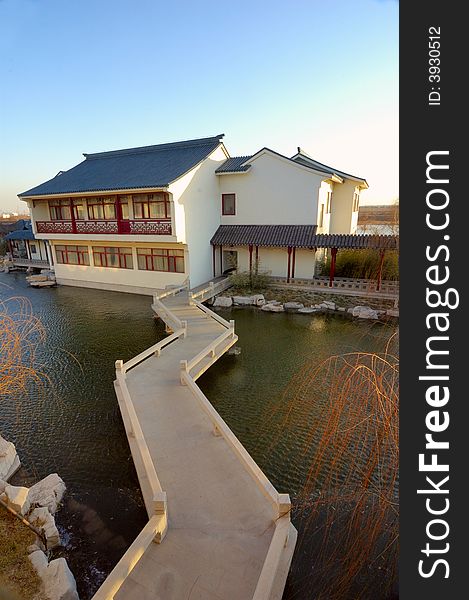 The winding bridge and house of Chinese gardens. The winding bridge and house of Chinese gardens