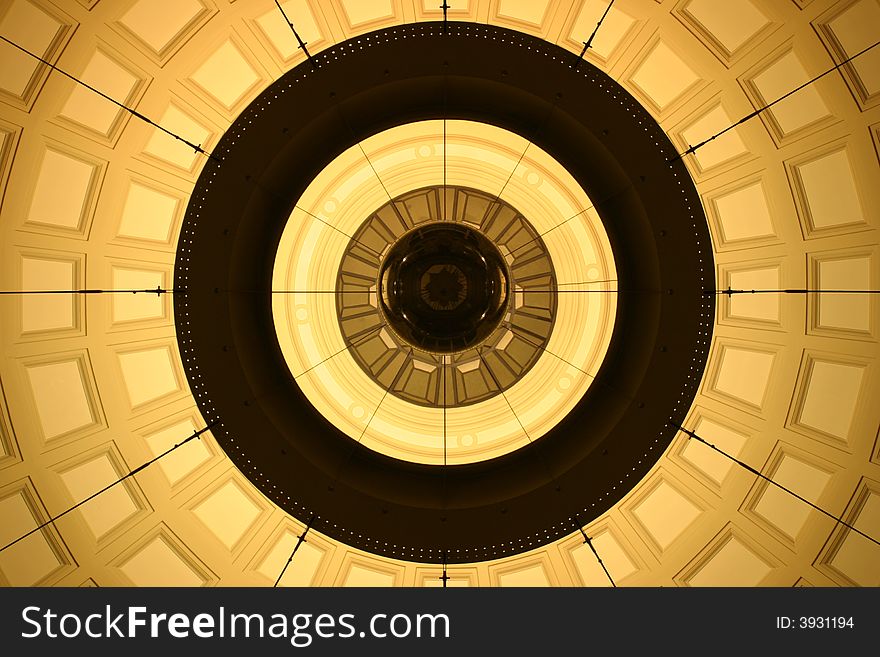 This is a lightsource in the middle dome of the hall in one of Barcelona's big train stations during the night. It was totally empty at that time, so I could take this photo, putting the camera on the floor and trying hard to get it all symmetrical. This is a lightsource in the middle dome of the hall in one of Barcelona's big train stations during the night. It was totally empty at that time, so I could take this photo, putting the camera on the floor and trying hard to get it all symmetrical.