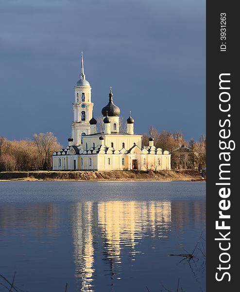 Orthodox church. River.Blue sky