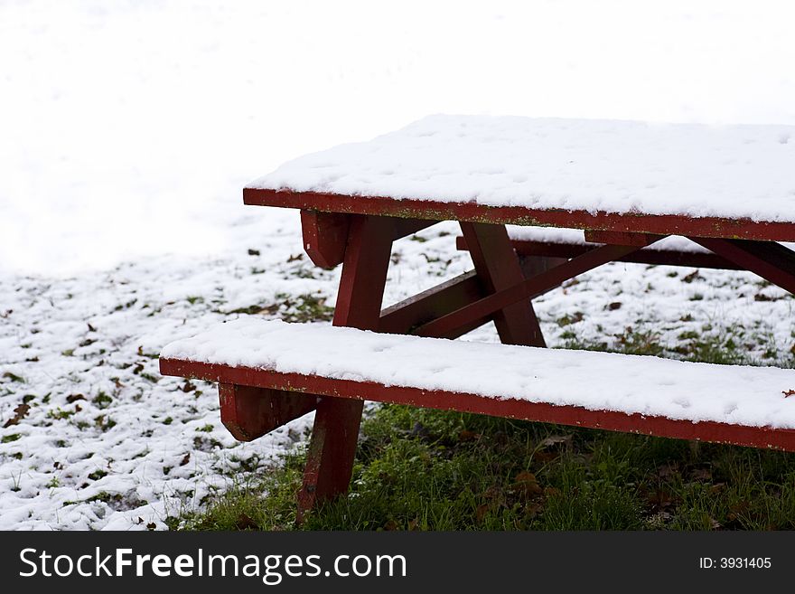 Snow Covered Red Picnic Table