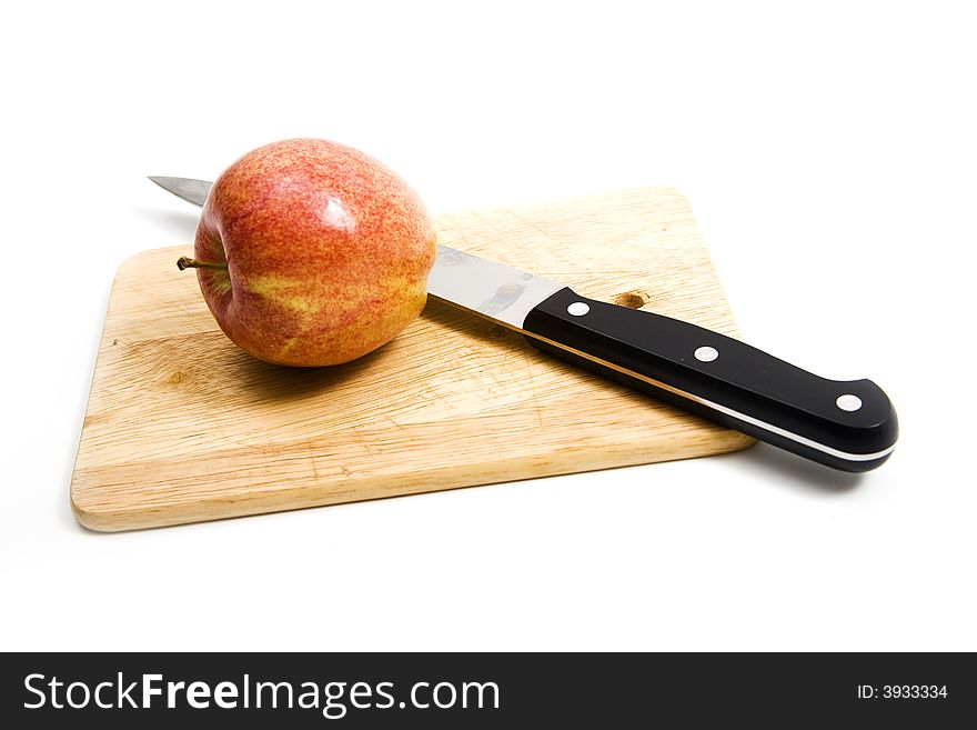 Apple and knife on desk. Apple and knife on desk