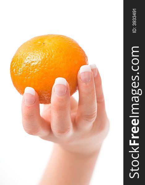 Womans hand holding a mandarin (white background isolated)